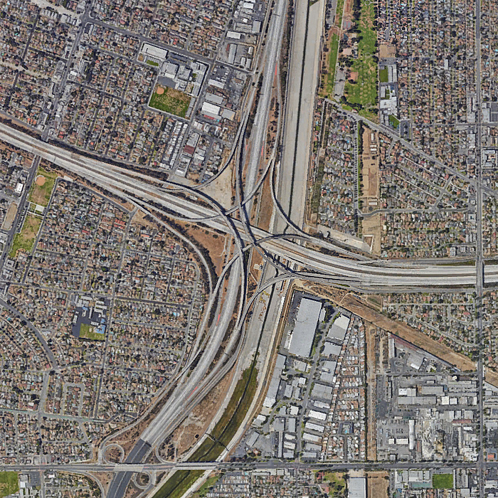 Aerial view of the large-scale point of intersection of the Interstate 710 and Interstate 105 city freeways in the centre of Los Angeles, California.