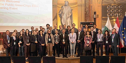 Group image in a historical university auditorium