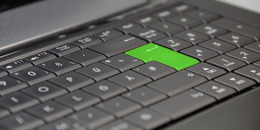Notebook keyboard with green enter key