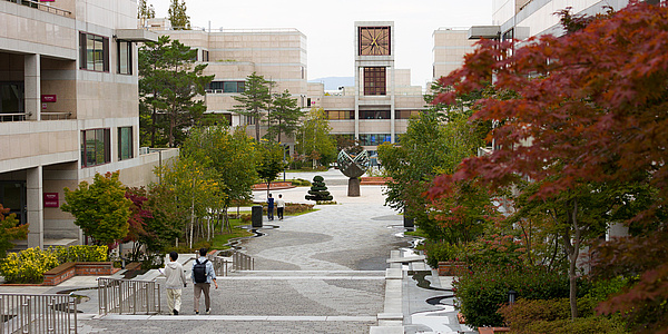 View of a university campus with many trees and buildings.