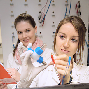 Two young women in a lab.